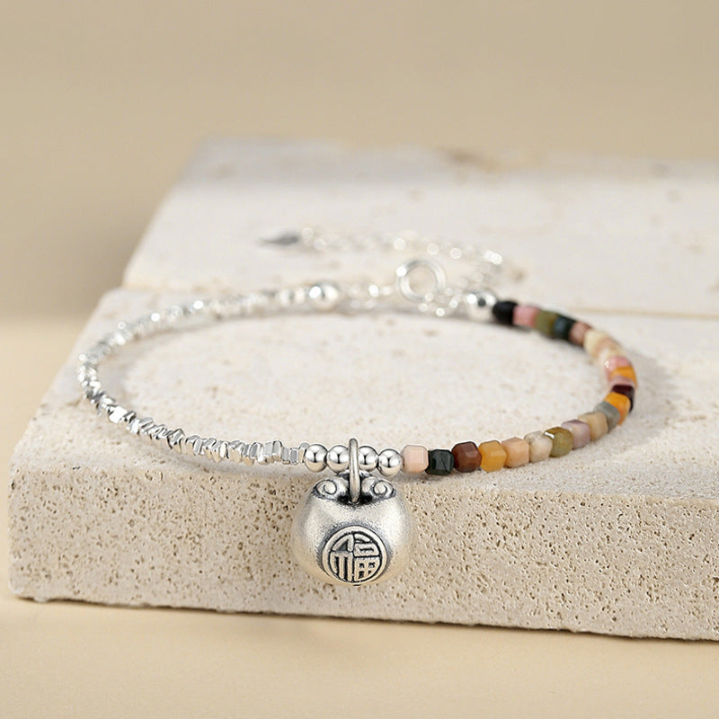 Agate fortune bag bracelet background hero