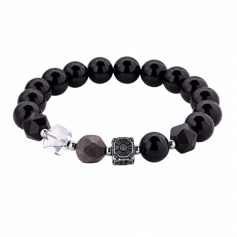 Complete Bagua obsidian bracelet with clear quartz on white background