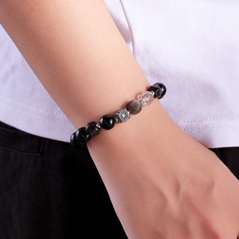 Model wearing the Bagua bracelet with a white shirt