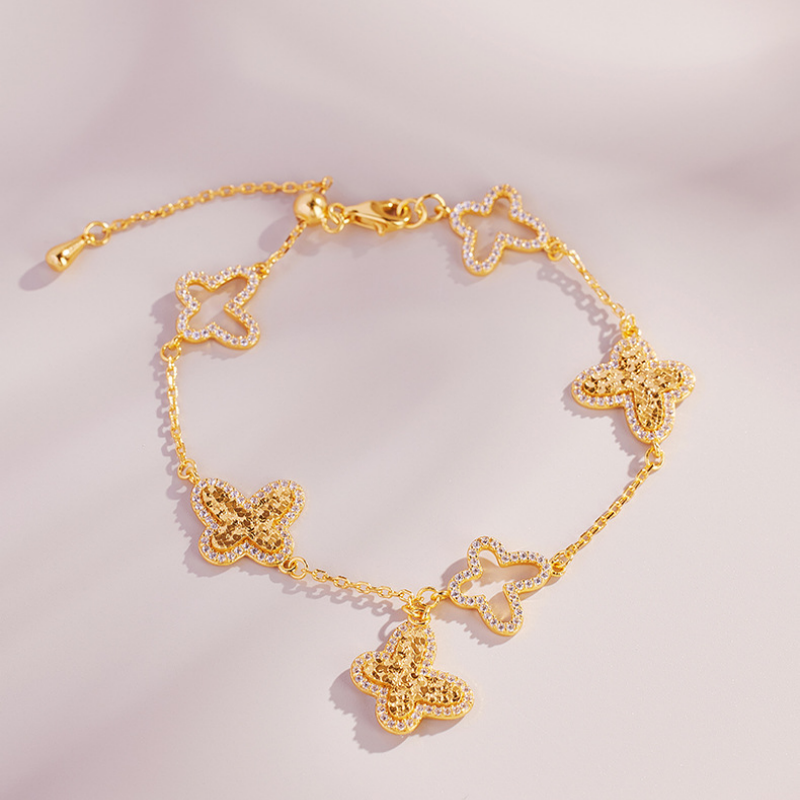 Complete butterfly bracelet on blush background