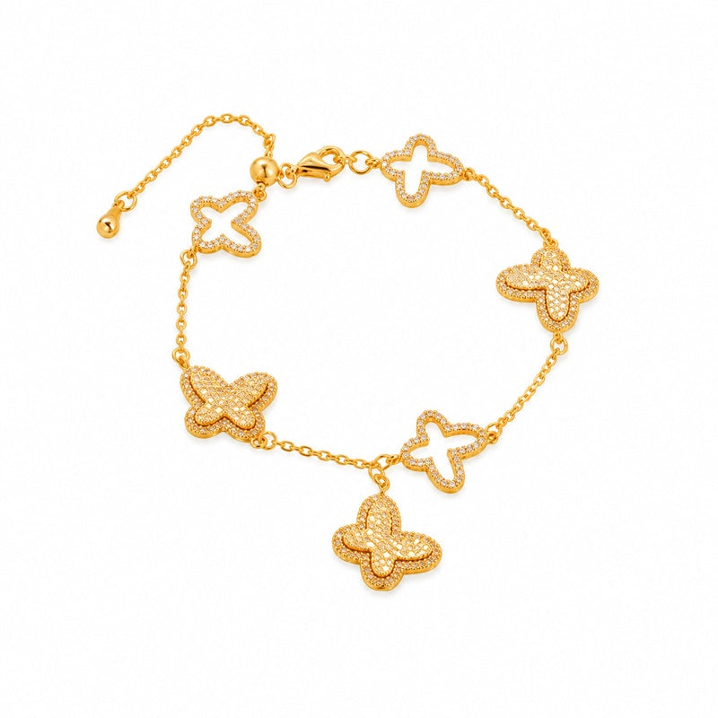 Complete gold-tone sterling silver butterfly bracelet on white