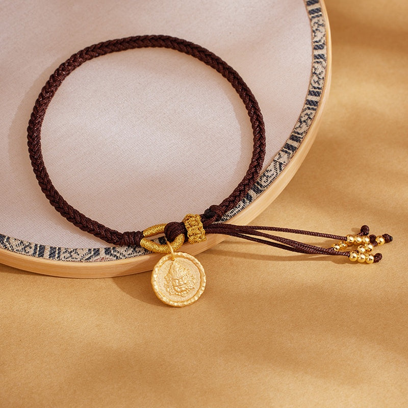 Adjustable deity bracelet beside a round display prop