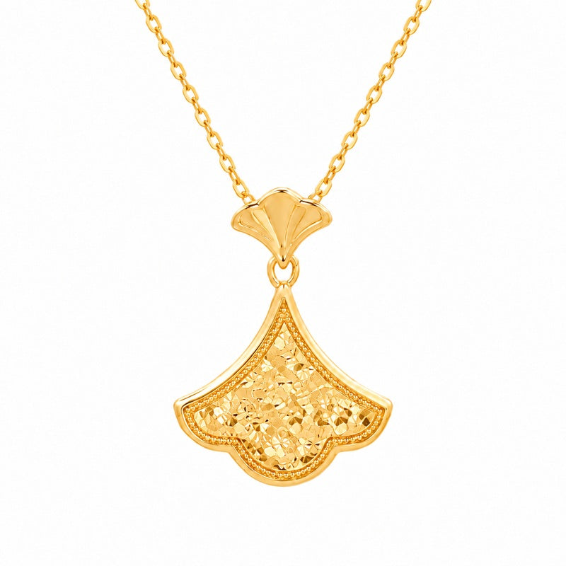 Ginkgo leaf necklace on white showing the linked pendant and fine chain