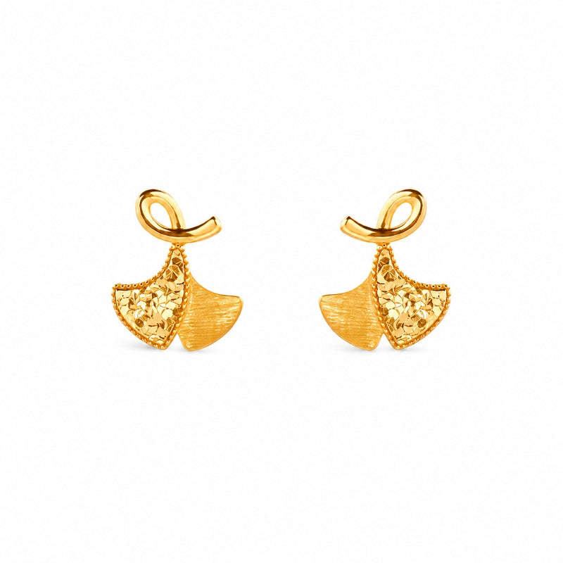 Front view of a matching pair of ginkgo leaf stud earrings on white