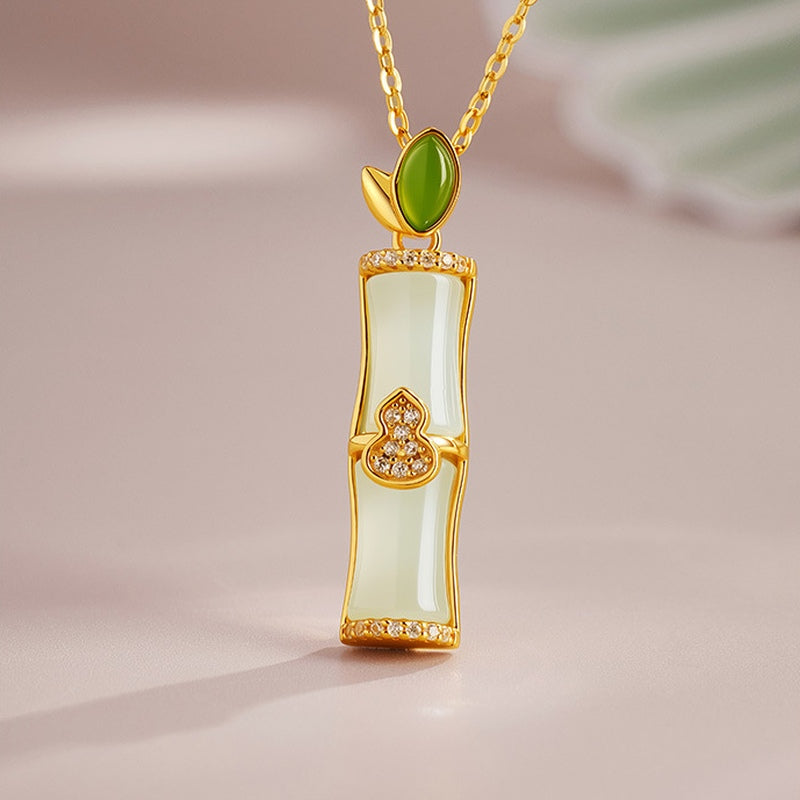 Jade bamboo gourd pendant resting upright
