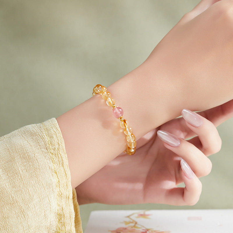 Supplier model wearing the yellow tower quartz and strawberry crystal bracelet