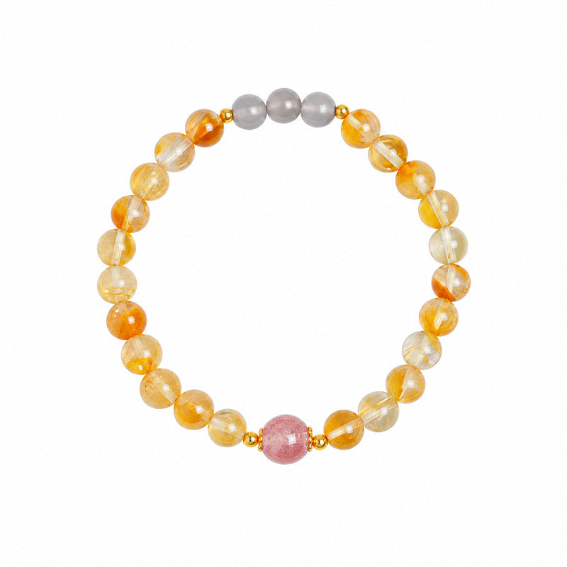 Complete bracelet on white showing three gray moonstone beads and one pink strawberry crystal focal bead