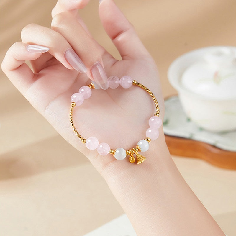 Supplier model wearing the rose quartz lotus bracelet