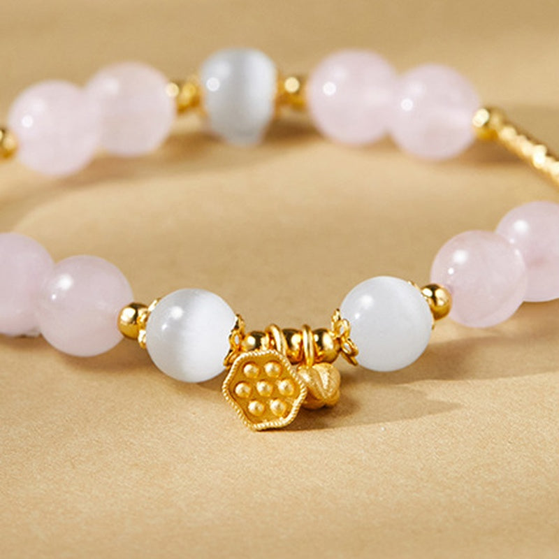 Close detail of lotus seedpod and bud charms