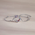 Butterfly moon silver bracelet on a warm beige background