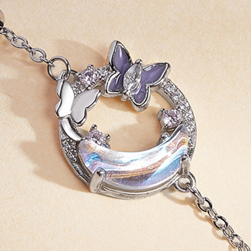 Cold enamel butterfly and iridescent crescent detail