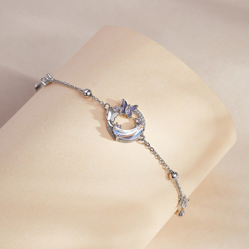 Butterfly moon bracelet on a display cushion