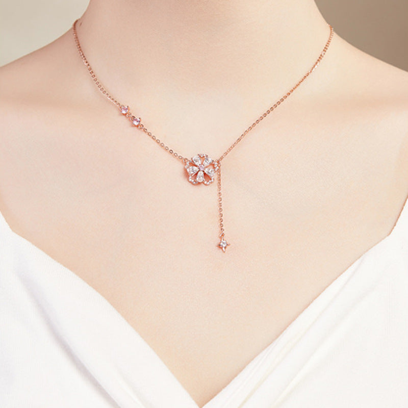 Supplier model wearing the peach blossom tassel necklace, front view