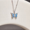 Blue cubic zirconia butterfly silver necklace on the original pale curved display
