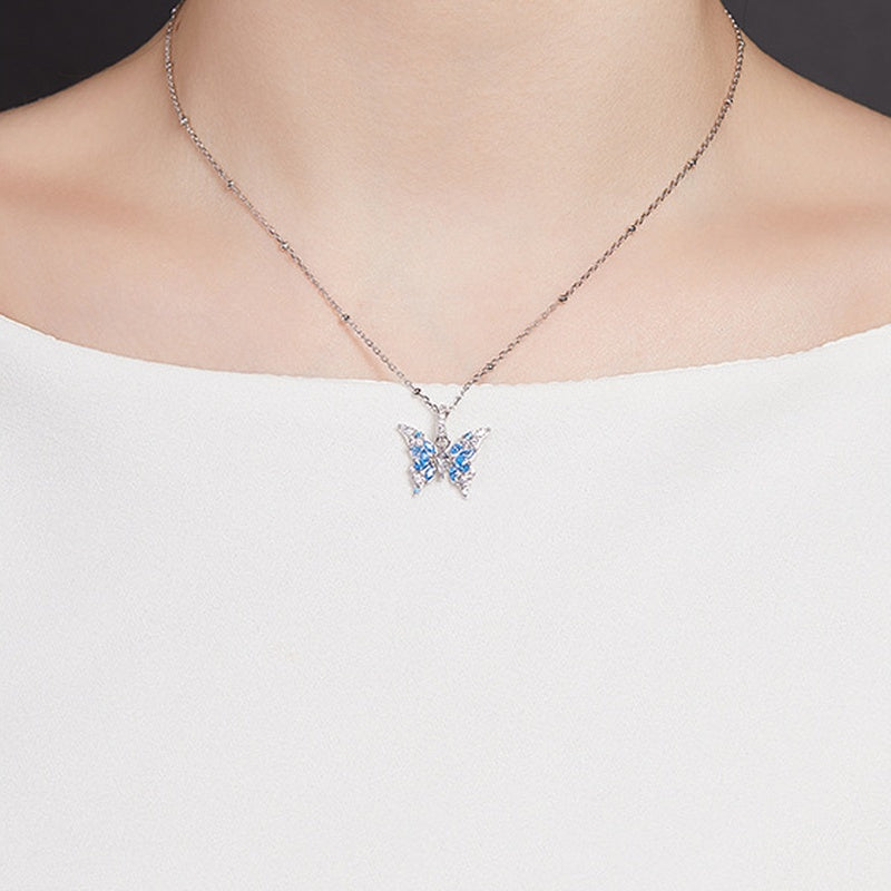 Original model wearing the blue butterfly silver necklace