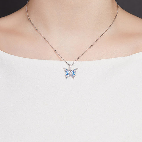 Original model wearing the blue butterfly silver necklace