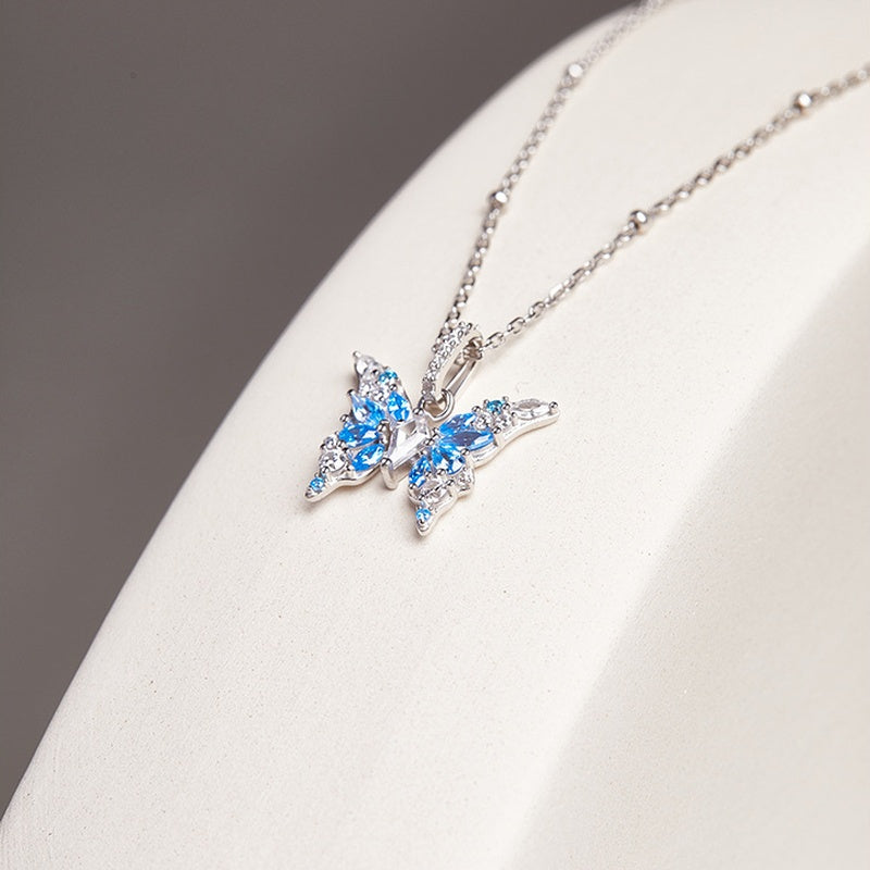 Original oblique view of the blue butterfly pendant and silver chain