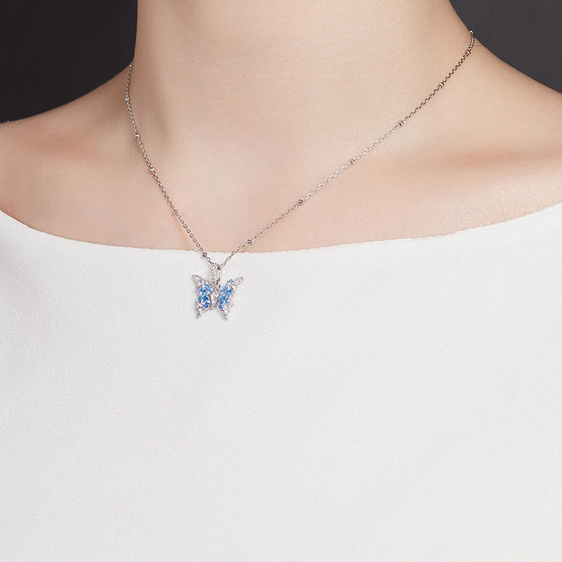 Original side-angle model photograph of the blue butterfly necklace