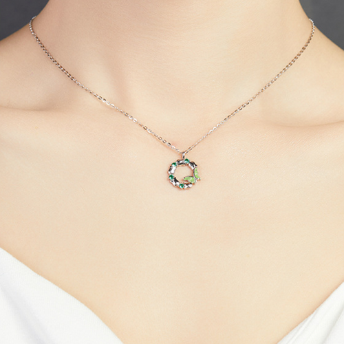 Supplier model wearing the green enamel butterfly wreath silver necklace