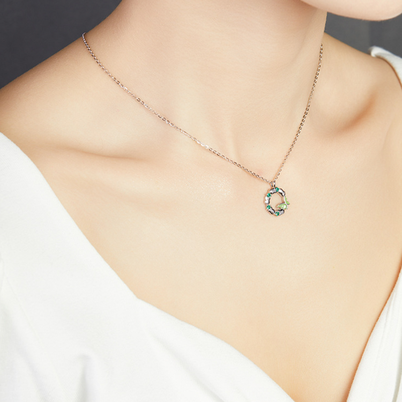 Side wearing view of the adjustable butterfly wreath necklace