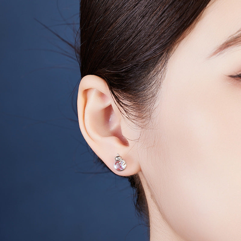 Original model wearing the cat stud earring