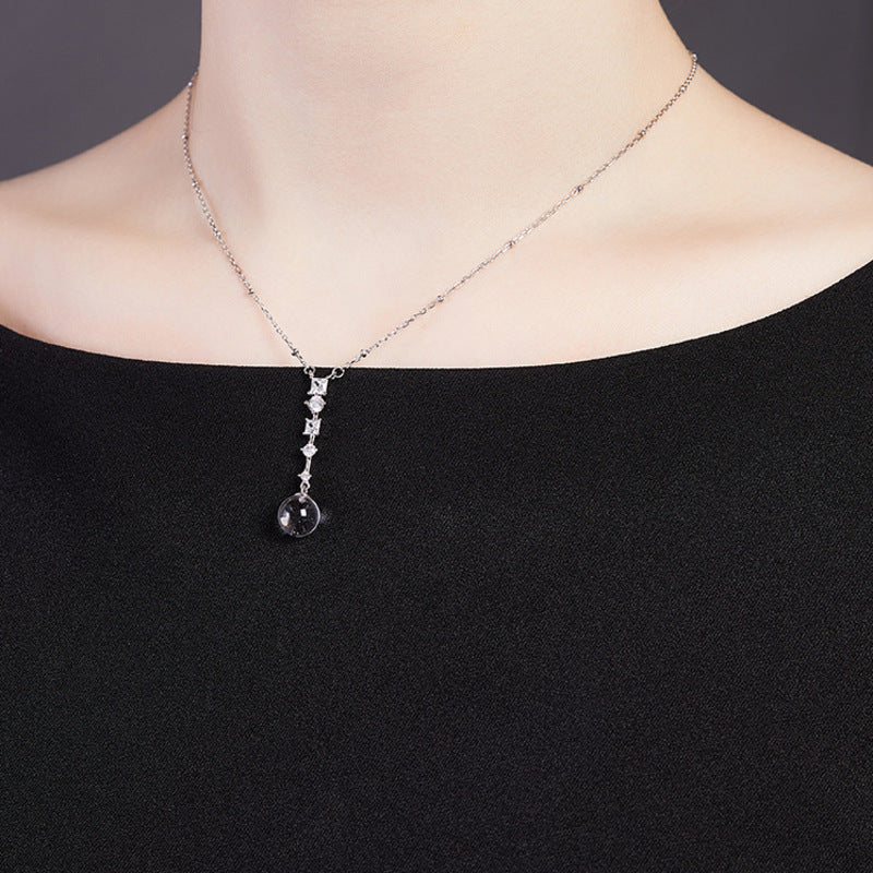 Angled supplier model view of the clear quartz necklace