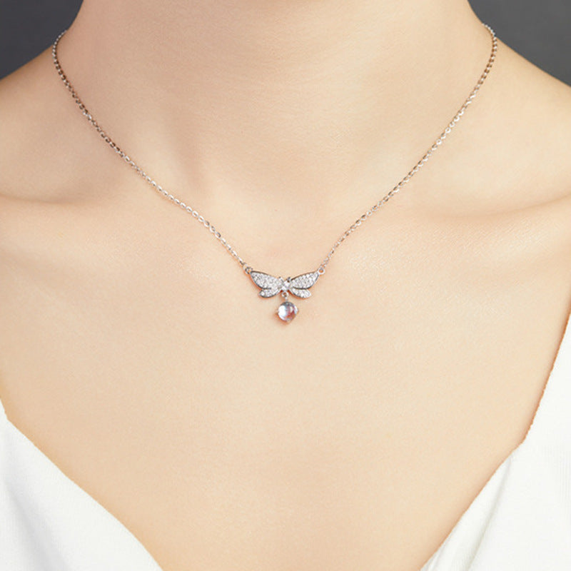 Original model wearing the dragonfly necklace, front view