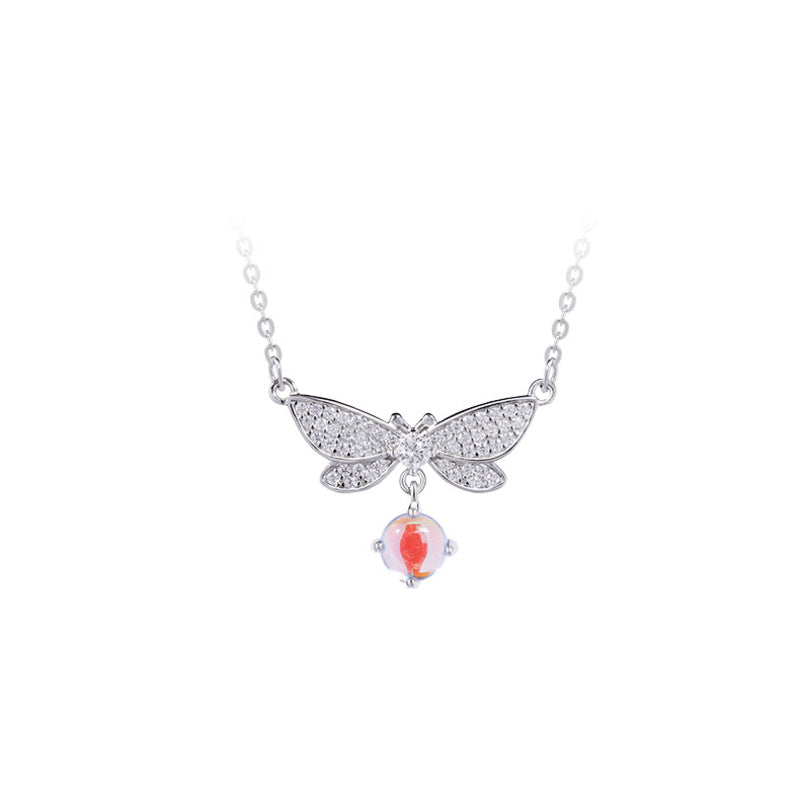 Dragonfly necklace and glass drop on white