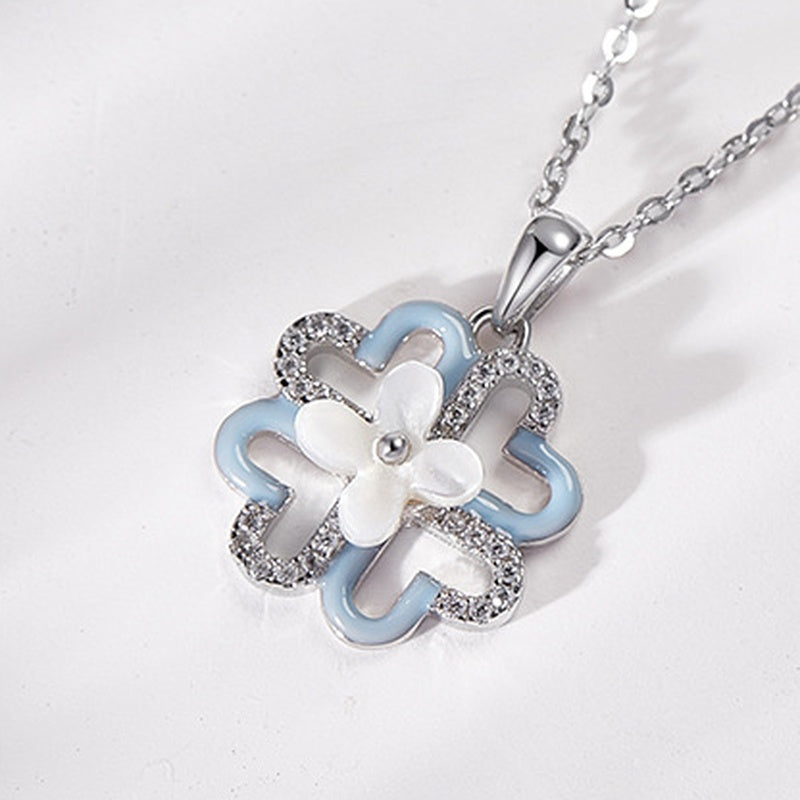 Oblique close-up of the polished clover pendant