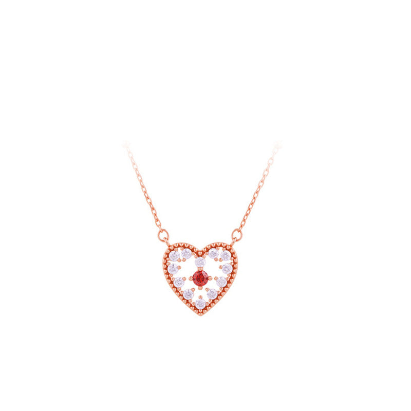Heart pendant necklace on white