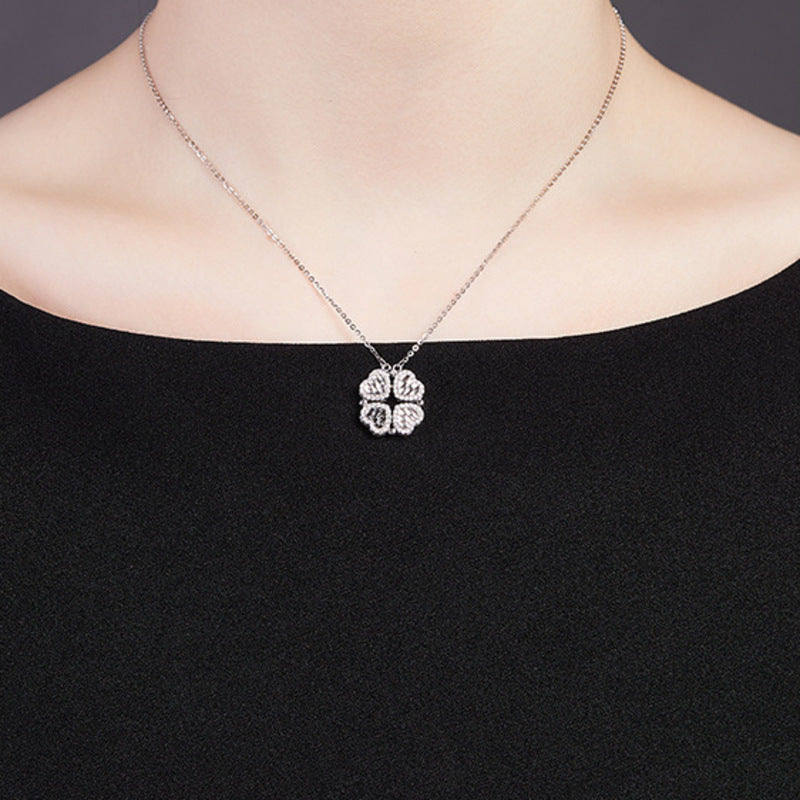 Original model wearing the silver necklace closed into a four-leaf clover