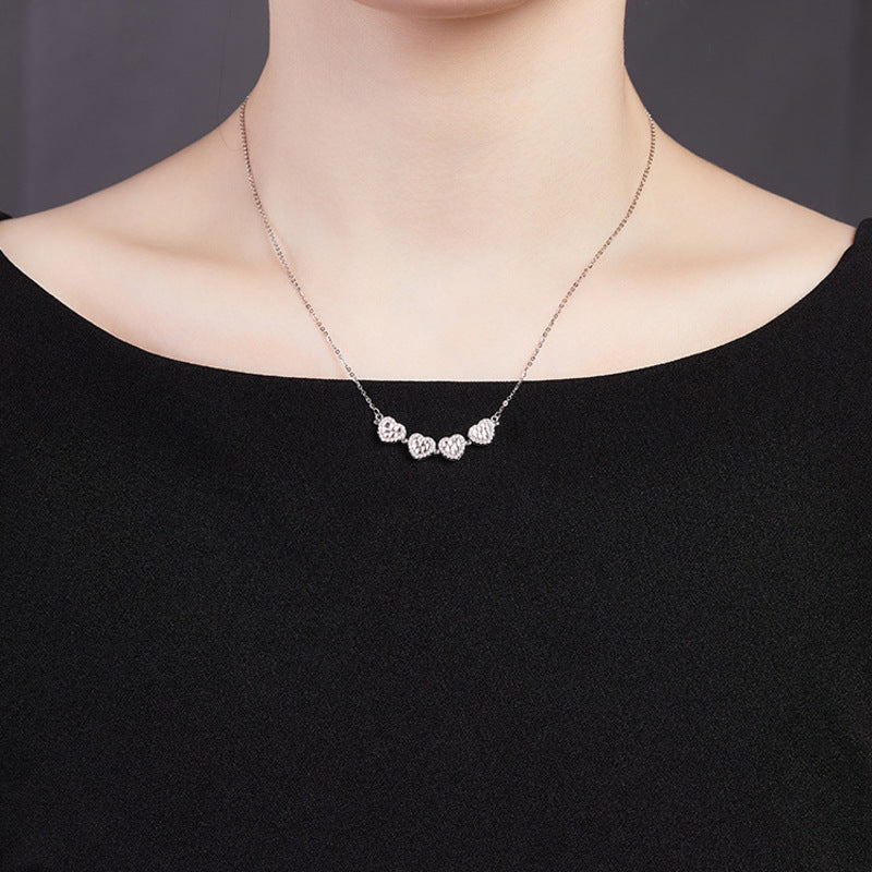 Original model wearing the unfolded row of silver hearts