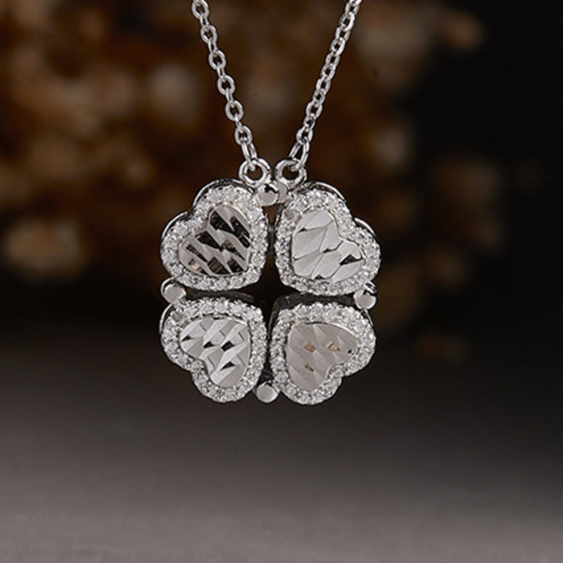 Close view of the clover pendant against a dark background