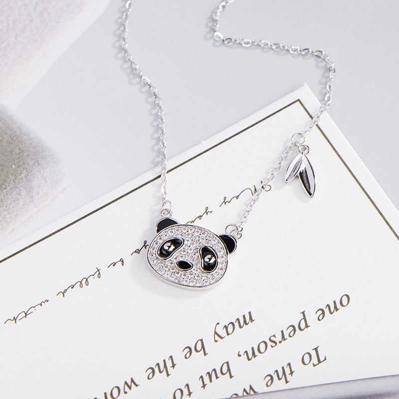 Panda necklace arranged on a printed card