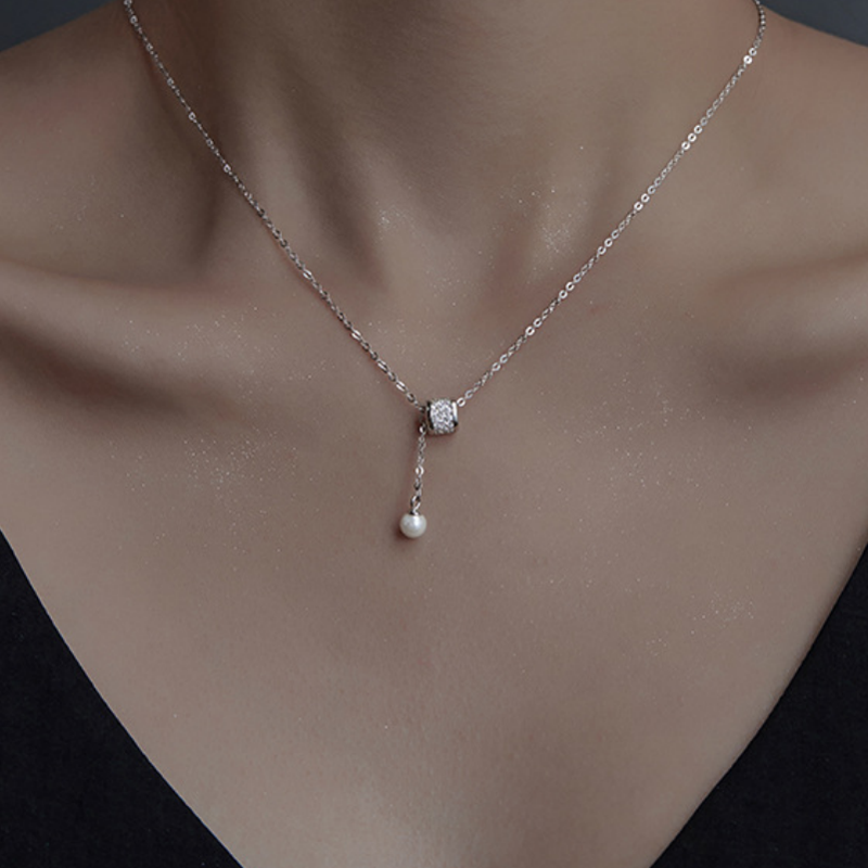 Front wearing view of the adjustable silver tassel necklace