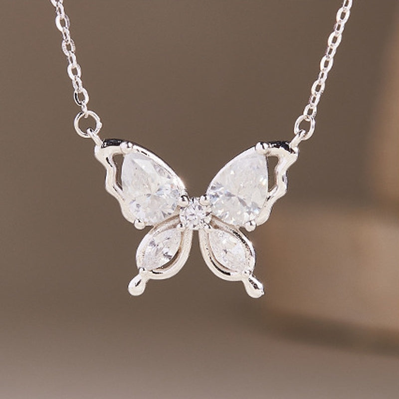 Front detail of clear butterfly wings and polished silver contours