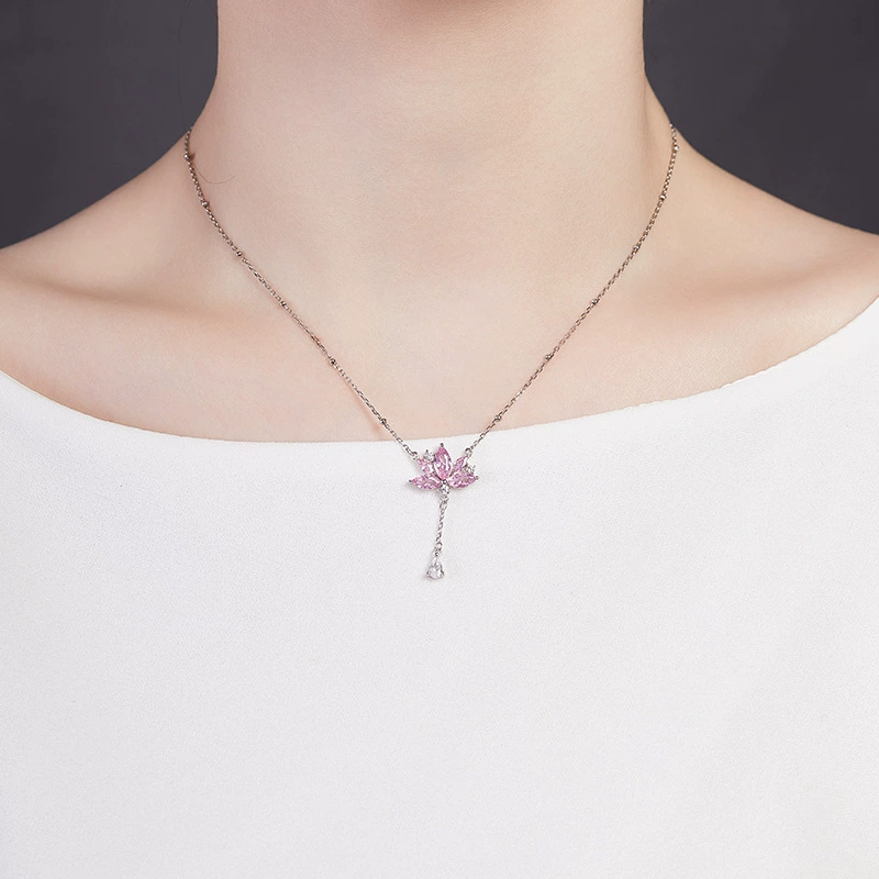 Supplier model wearing the pink lotus tassel necklace