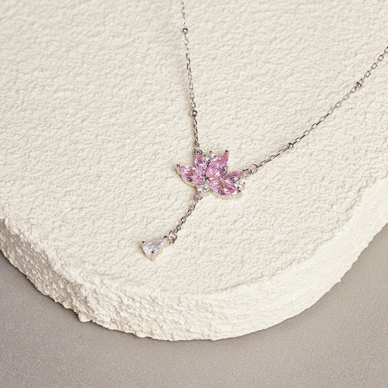 Angled view of pink lotus petals and teardrop tassel