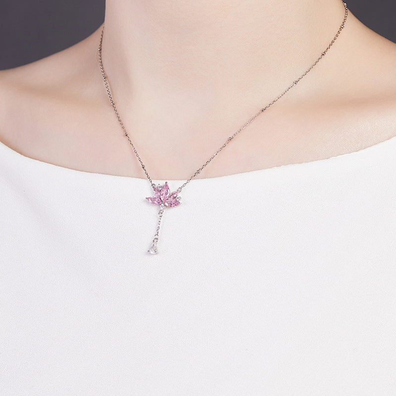 Side angle of the supplier model wearing the lotus necklace