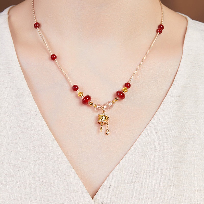 Original model wearing the red agate and clear quartz necklace