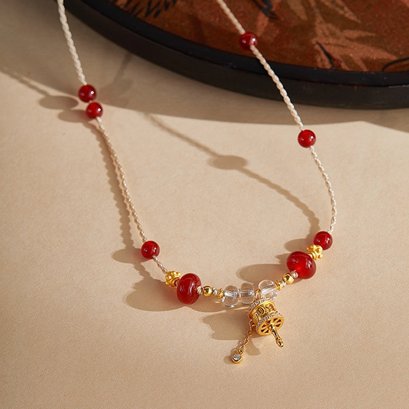 Original oblique necklace view beside a decorative tray