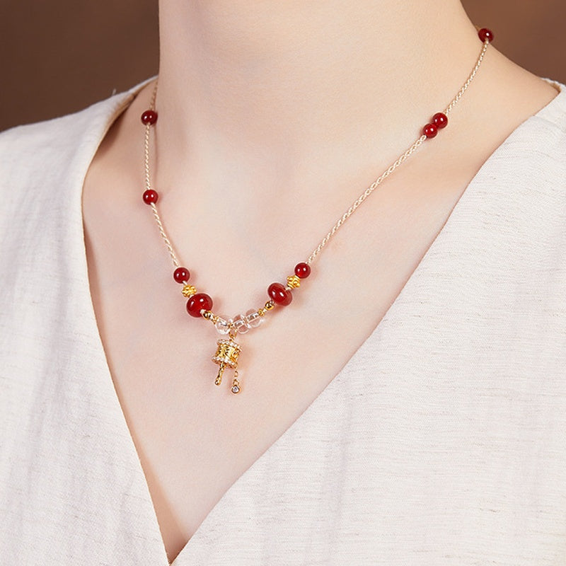 Original model wearing the necklace from the side