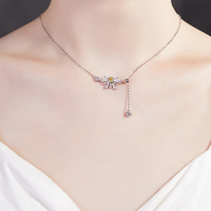 Model wearing the daisy silver tassel necklace
