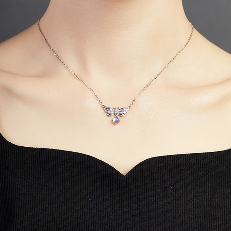 Original model wearing the purple enamel butterfly necklace