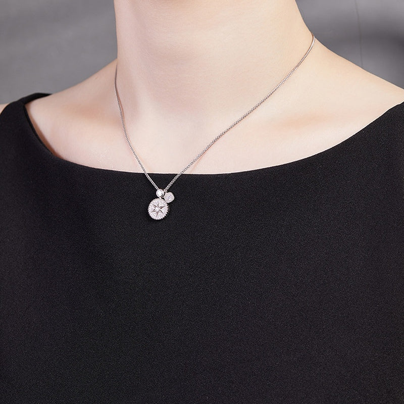 Original angled model view of the star compass necklace