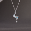 Star and moon silver necklace on its original grey background