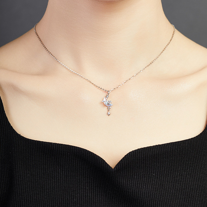 Original model wearing the star and moon necklace