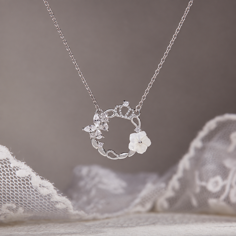 Crown wreath necklace against original taupe background and lace