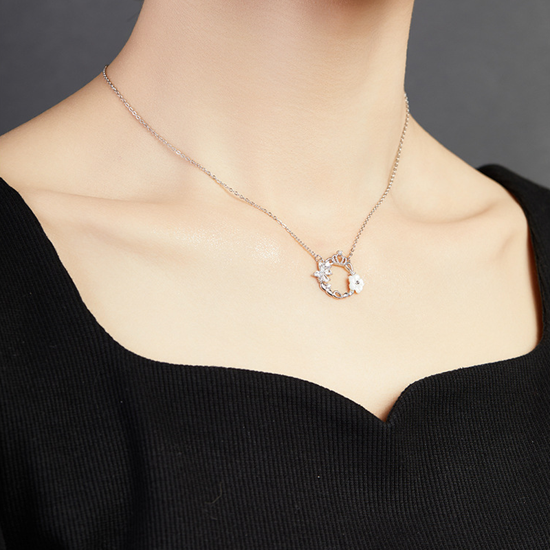 Original model wearing crown wreath necklace side view