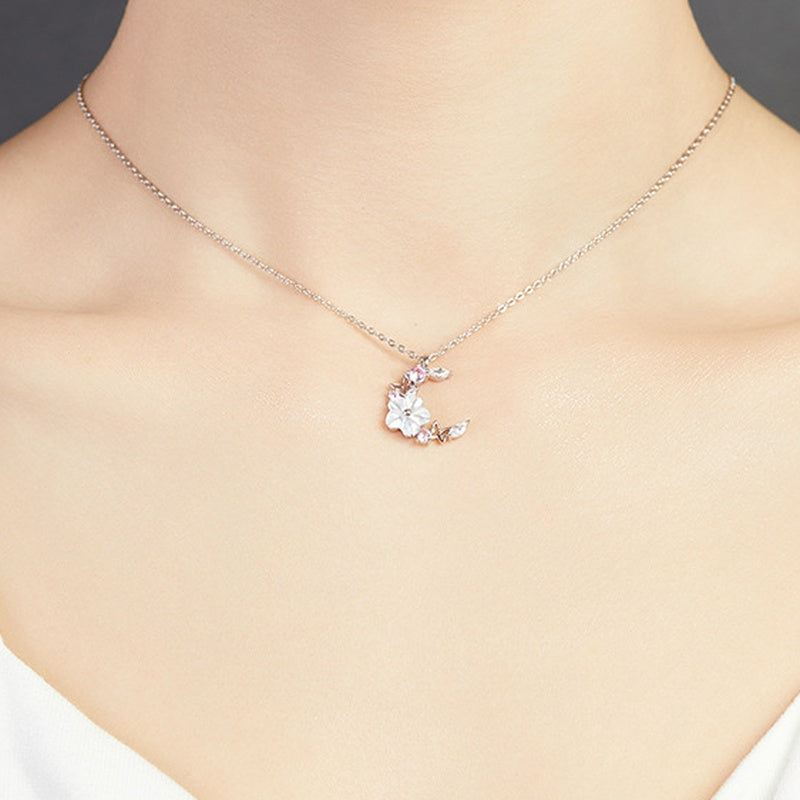 Supplier model wearing the moon and blossom necklace